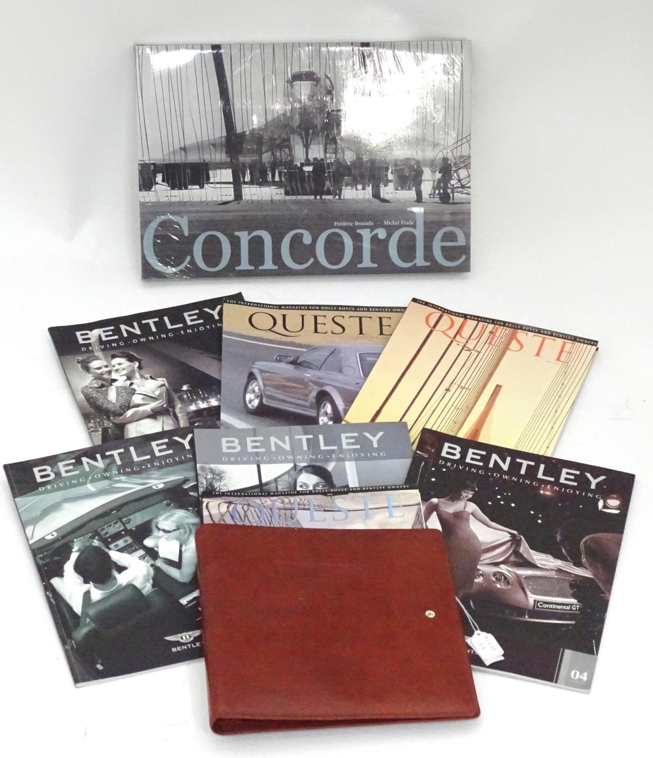 A leather folder embossed with the Bentley car logo. Together with some Bentley magazines and a book