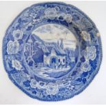 A 19thC blue and white plate decorated with a pastoral scene Please Note - we do not make