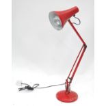 A red angle poise lamp Please Note - we do not make reference to the condition of lots within