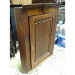 An oak corner cupboard Please Note - we do not make reference to the condition of lots within
