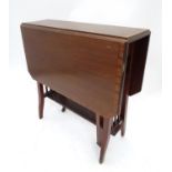 An early 20thC mahogany Sutherland table with canted corners Please Note - we do not make