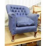 A blue upholstered button back armchair Please Note - we do not make reference to the condition of