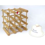 A Harrods cheese dish and cover, together with a pine wine rack with provision for 9 bottles