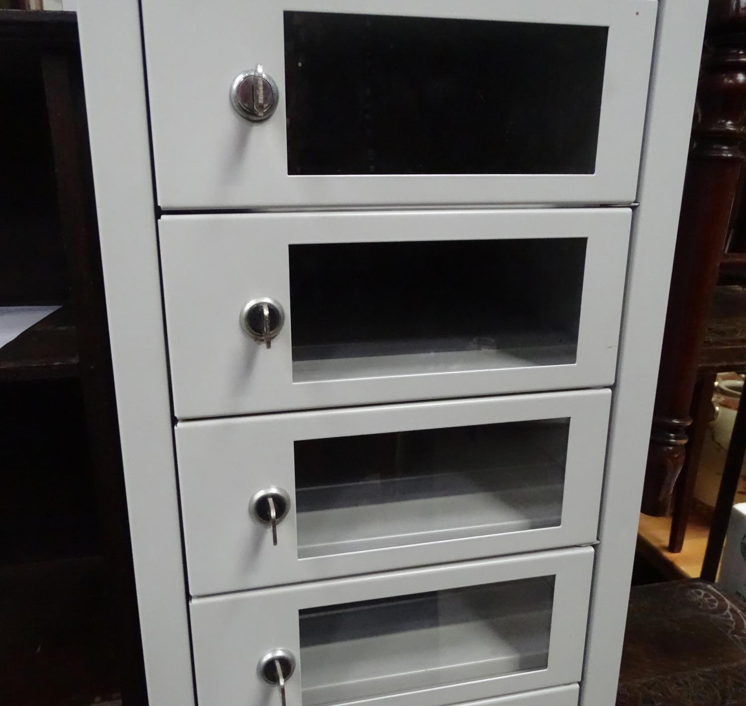 A late 20th / early 21stC metal cabinet by EFG containing 16 separate locking sections Please Note - - Image 2 of 6