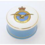 Militaria: a late 20thC porcelain trinket box, the lid decorated with the Royal Air Force emblem,