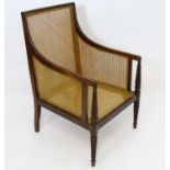 A mahogany bergere armchair Please Note - we do not make reference to the condition of lots within