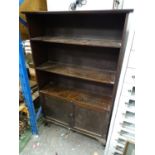 A 20thC utility bookshelf with cupboard under Please Note - we do not make reference to the