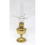 A late 20thC oil lamp Please Note - we do not make reference to the condition of lots within