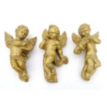 Three plaster and gilt wall hangings formed as cherubs (3) Please Note - we do not make reference to