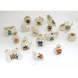 A collection of crested ware, to include Baskingstoke teapot, City of London man in the moon,