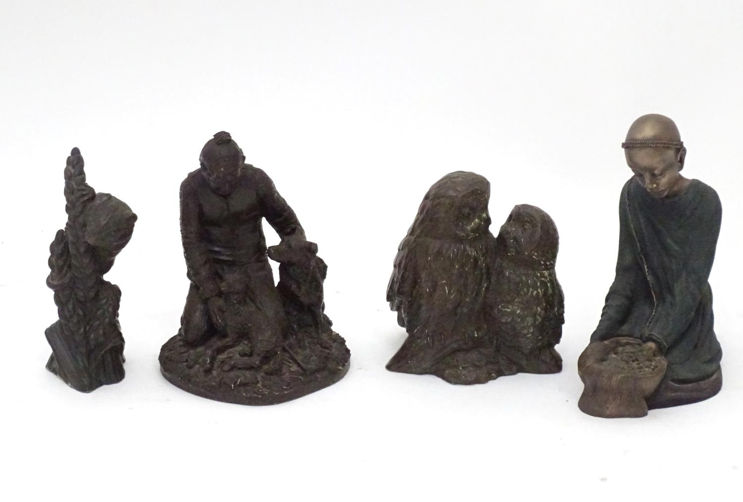 Four assorted figures Please Note - we do not make reference to the condition of lots within