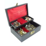 A jewellery box and contents comprising costume jewellery, coins etc. Please Note - we do not make