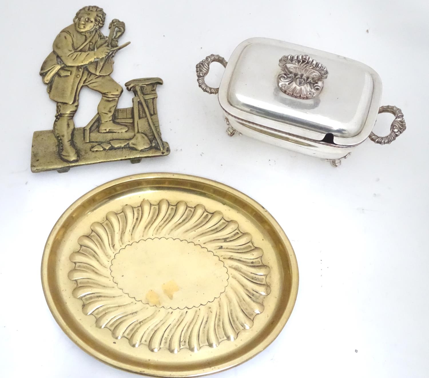 A silver plated butter dish and cover together with two brass items Please Note - we do not make