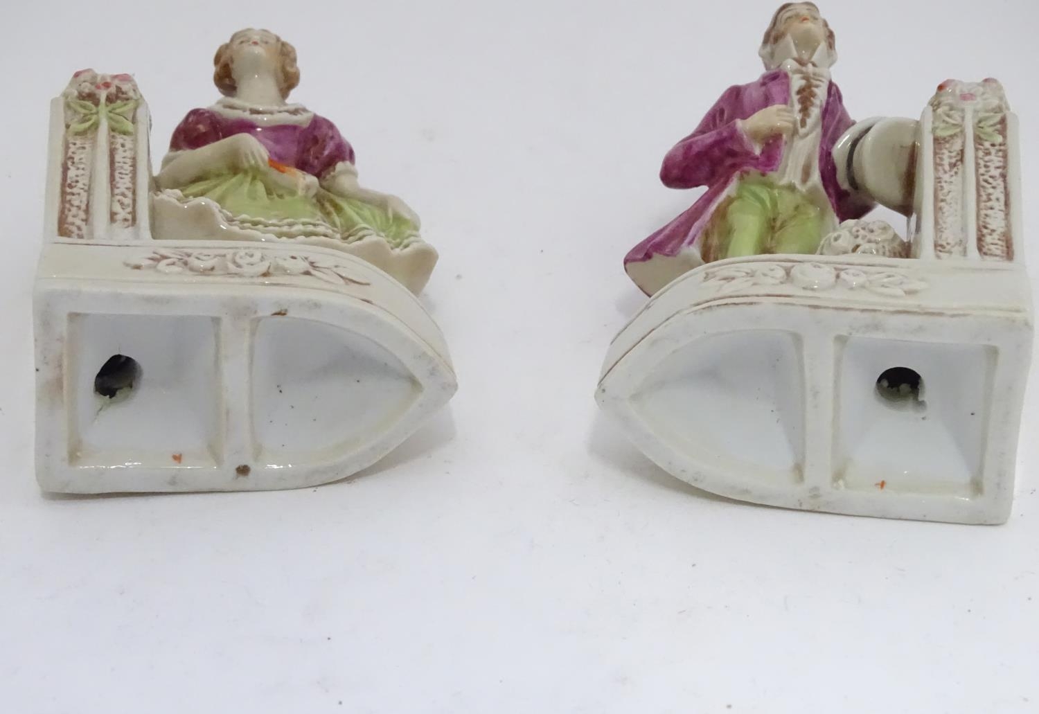 A pair of German porcelain figural bookends depicting a gentleman and a lady with flowers. Marked - Image 3 of 13