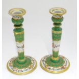 A pair of 19thC Continental ceramic candlesticks in the manner of Meissen Please Note - we do not