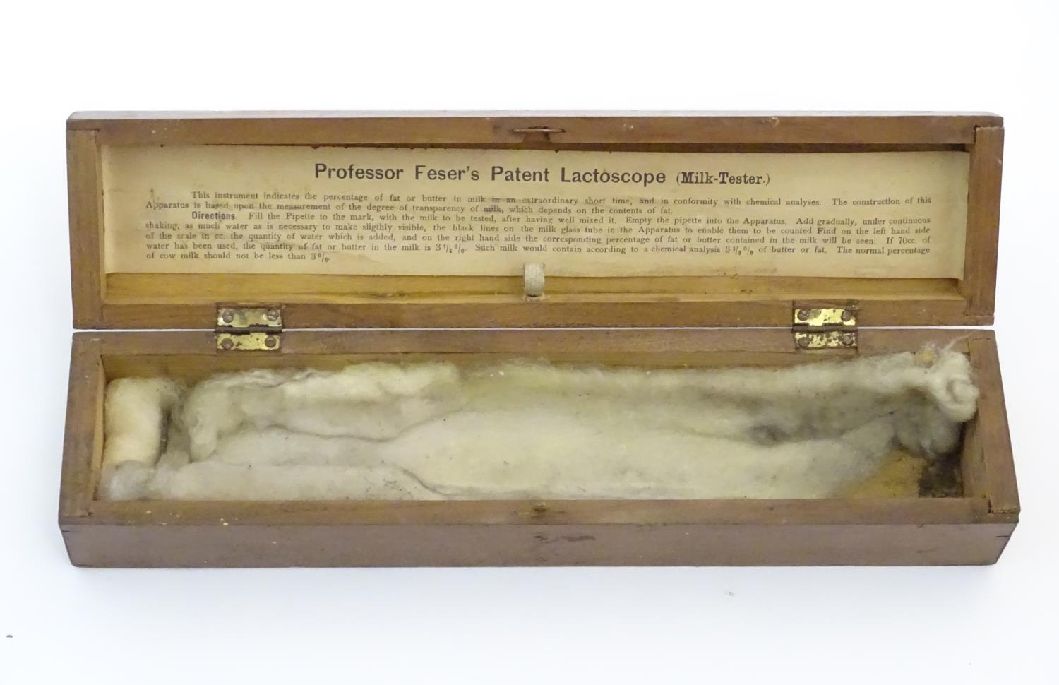 A 20thC cased glass Lactoscope with metal base, the interior with label: 'Professor Feser's Patent - Image 7 of 7