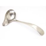 A silver cream ladle, hallmarked Sheffield 1958, maker Viners Ltd. Approx. 5" long Please Note -