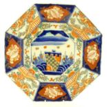 A Japanese octagonal plate in the Imari palette decorated with birds, flowers and foliage, with