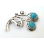 Scandinavian jewellery: A Danish silver brooch set with turquoise cabochon detail, maker Hermann