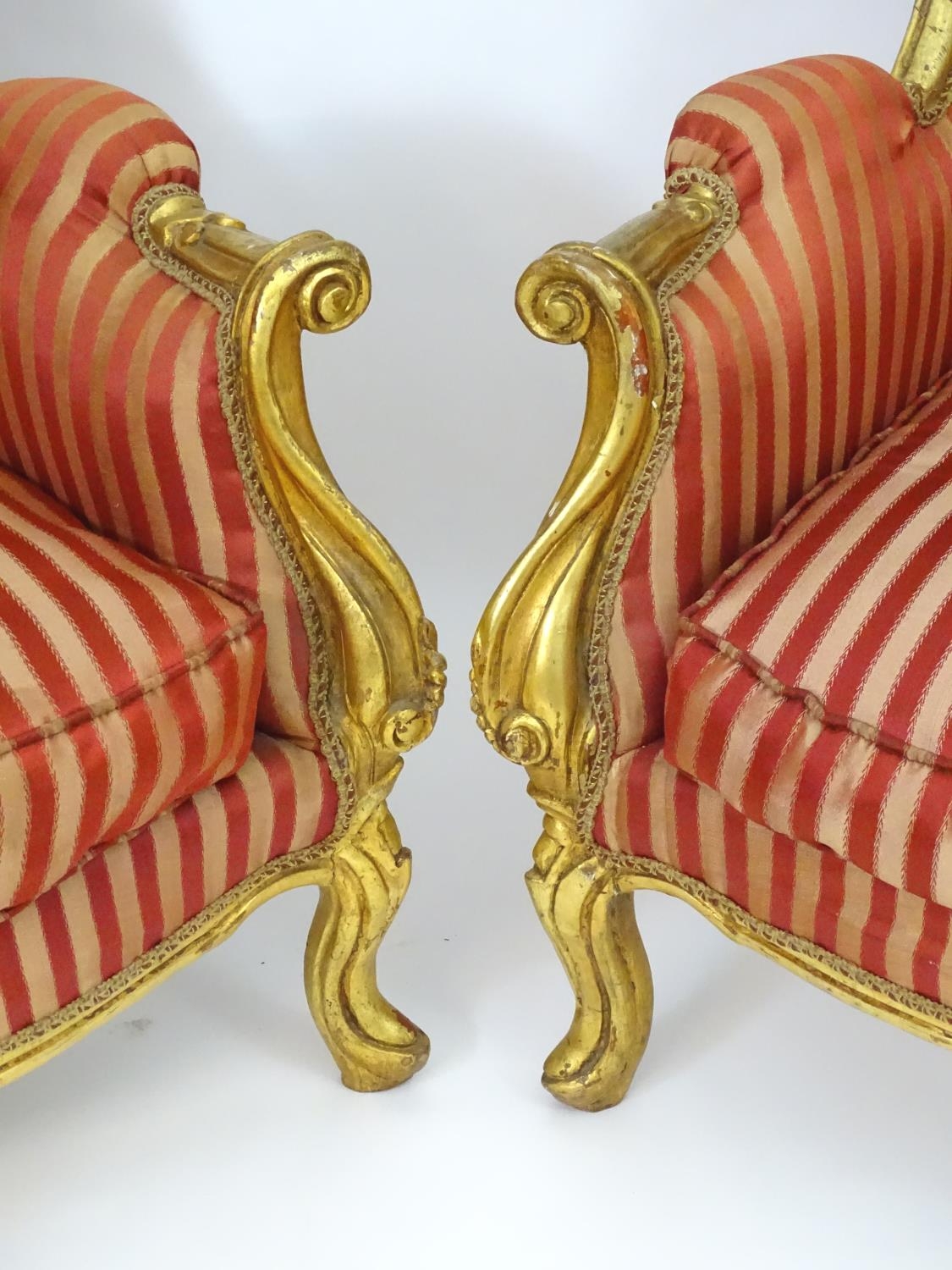 A pair of mid 20thC large gilt wingback armchairs, having moulded frames with floral decoration, - Image 5 of 7