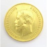 Coin: A gold 1901 ten / 10 rouble coin, depicting a portrait of the Emperor Nikolai II. Approx. 7/8"