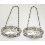Two silver decanter labels / wine labels / bottle tickets engraved ' Whisky ' and ' Brandy '