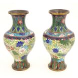 A pair of Oriental cloisonne vases with scrolling floral and foliate decoration. Approx. 9 1/2" high