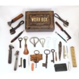 An early 20thC workbox, containing an assortment of tools and implements, including a folding