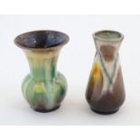 Two West German vases, one of conical form, the other with a flared rim. Marked under 571/12, and