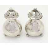 A pair of silver pepper pots, hallmarked Birmingham 1899 maker Thomas Latham & Ernest Morton. Approx