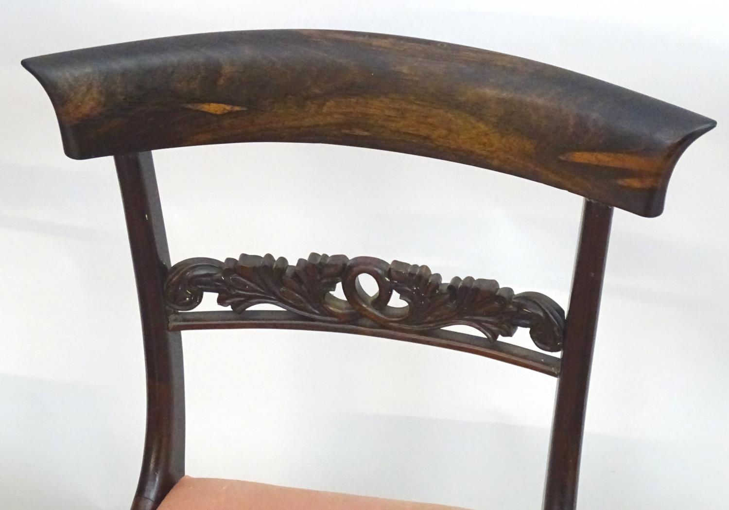 A set of four William IV rosewood dining chairs with shaped top rails, pierced mid rails, drop in - Image 4 of 14