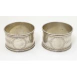 Two Victorian silver napkin rings, hallmarked Birmingham 1874, maker George Unite. (2) Please Note -