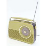 Vintage retro : A vintage style beige Bush radio with handle and leatherette detail. Model no.