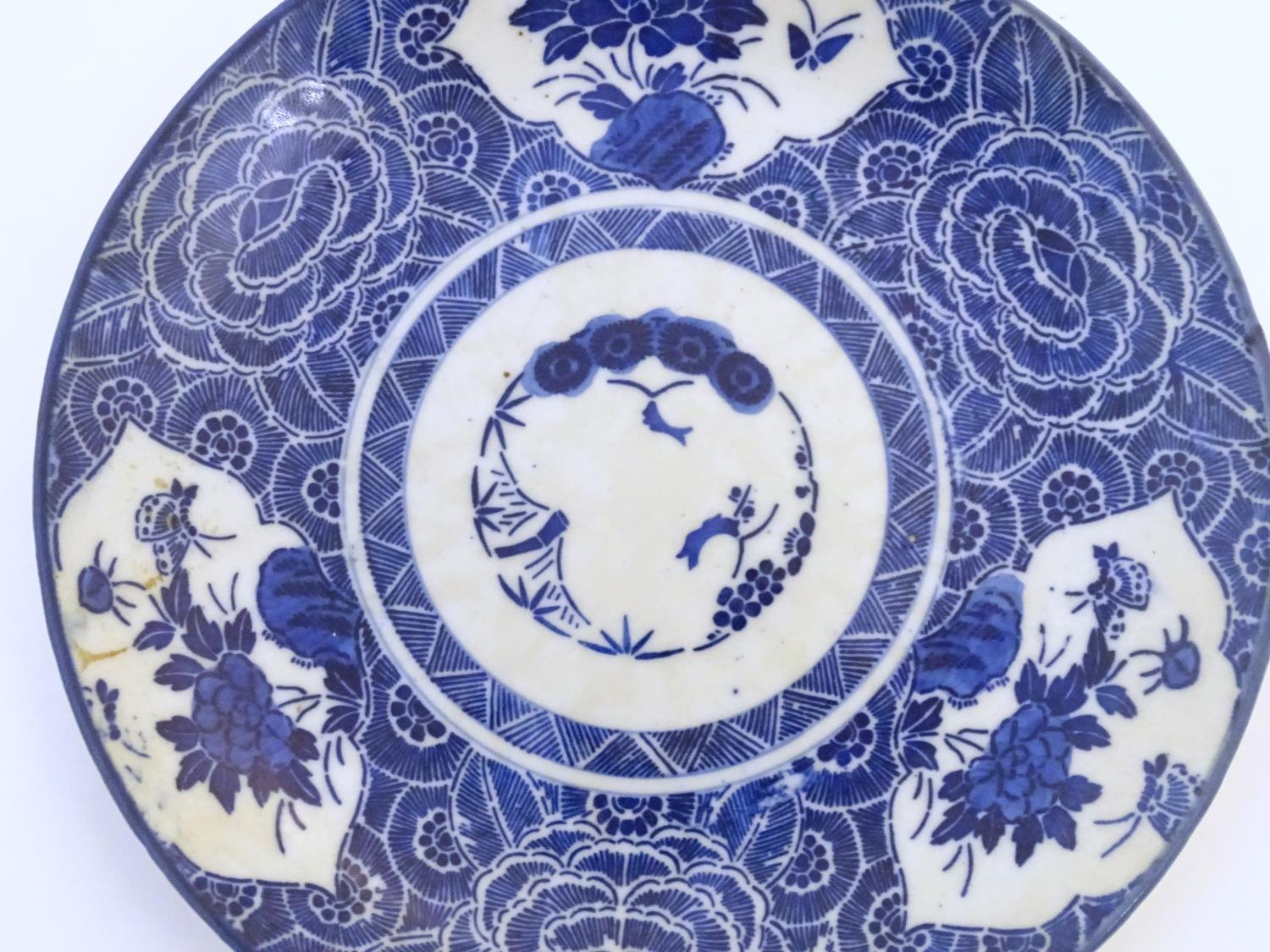 An Oriental blue and white plate with stylised peony detail, and stylised scrolling flower motifs to - Image 8 of 8