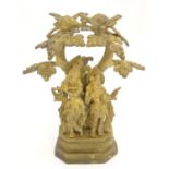 A 20thC Indian cast brass figural group depicting Krishna playing the flute for Radha under a tree