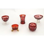 An assortment of Bohemian ruby glass ware, to include salts, pot, liqueur glasses etc, the largest 2