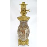 An early 20thC Satsuma vase table light, with ornate gilt base and light fitting, 20 1/2" tall
