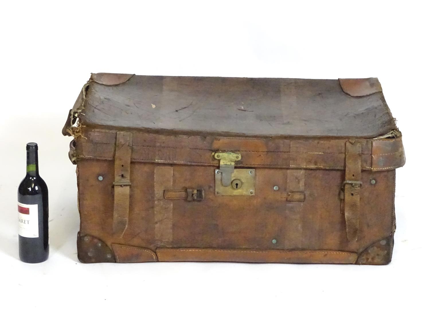 A late 19th / early 20thC leather travelling trunk with two carry handles. Approx. 14" x 32" x 21" - Image 3 of 4