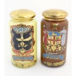 Two 20thC opaque glass specie / chemist / apothecary jars of cylindrical form with domed gilded