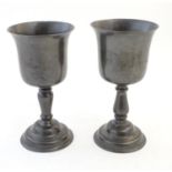 A matched pair of 19thC pewter pedestal cups / goblets. Largest approx. 9 1/4" high (2) Please