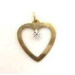 A 9ct gold heart shaped pendant set with central diamond. Approx 3/4" long Please Note - we do not
