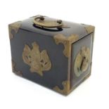A Chinese black lacquered playing card box with hidden lock and brass mounts with bat and yin yang