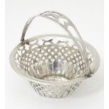 A silver bonbon dish of basket form with pierced detail and swing handle, hallmarked Birmingham c.