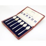 A cased set of 6 silver souvenir teaspoons Hallmarked 1952 at various assay offices and stamped with