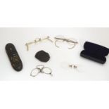 A quantity of 19thC and later glasses / eye wear to include half moon spectacles, cased pince nez,