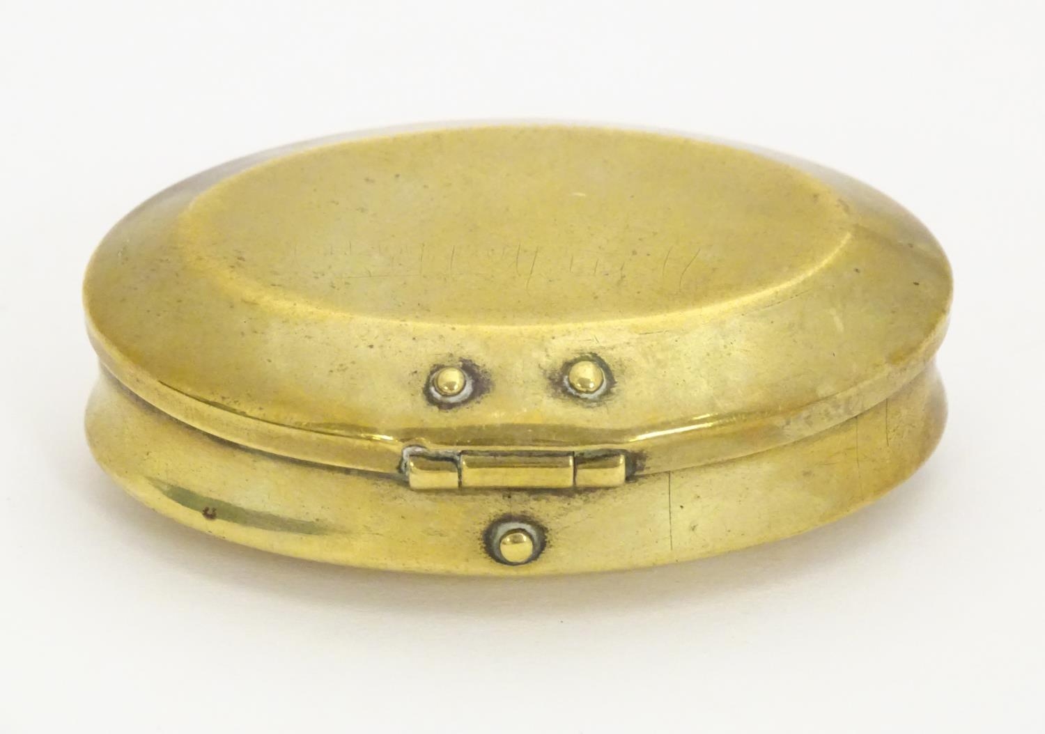 A Victorian brass snuff box of oval form, marked under Solid Brass. Approx. 1 3/4" x 2 3/4" Please - Image 9 of 16