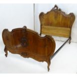 A French carved walnut bed with crested headboard and scrolled detail. Headboard 62 1/2" wide Please