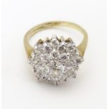 A 9ct gold ring set with white stone cluster. Ring size approx I Please Note - we do not make