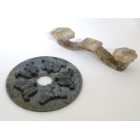 Two Oriental items comprising a jade coloured hardstone bi disc with relief bat decoration and a