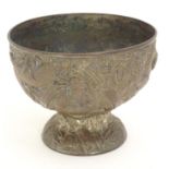 An Oriental cast pedestal bowl with relief decoration depicting dragons amongst bamboo. Approx. 4